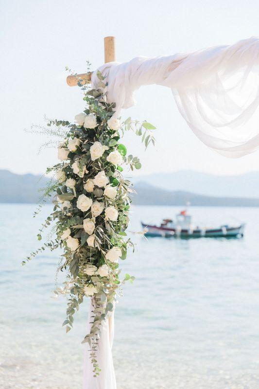 beach wedding arch flowers in green and white