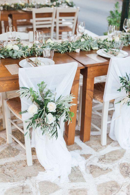Green and white mr and mrs chairs flower decoration