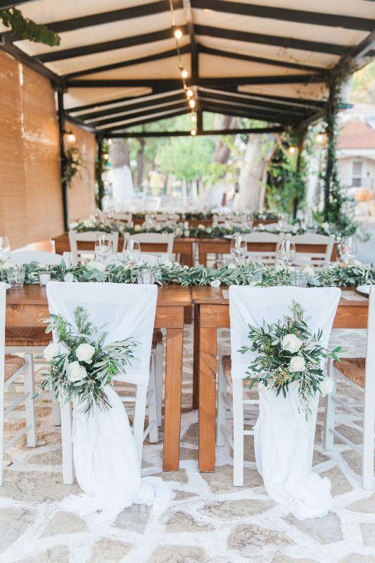 Greek taverna with white flower and green olive decoration